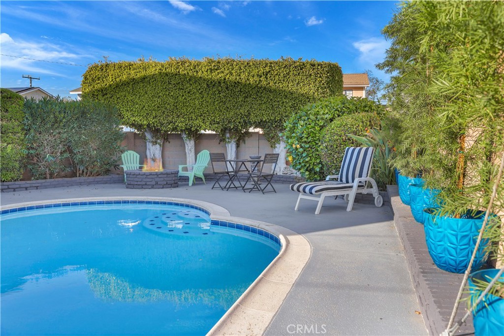 4312 Myra Avenue Cypress, CA 90630 - Photo 3 of 38 a view of a swimming pool with a patio