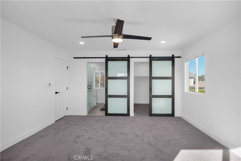 4312 Myra Avenue Cypress, CA 90630 - Photo 38 of 38 a view of a livingroom with a ceiling fan and window