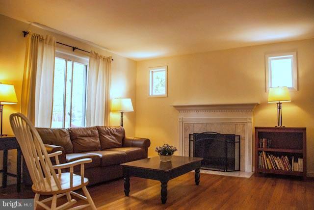 12607 Bluhill Road Silver Spring, MD 20906 - Photo 14 of 26 a living room with furniture and a fireplace