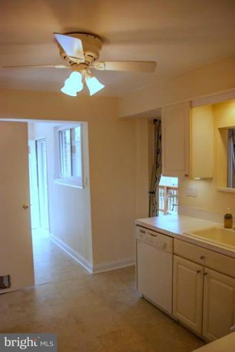 12607 Bluhill Road Silver Spring, MD 20906 - Photo 25 of 26 a view of a kitchen with a sink cabinet and a window