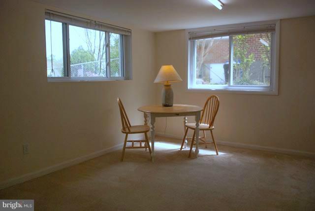 12607 Bluhill Road Silver Spring, MD 20906 - Photo 5 of 26 a dining room with furniture and windows