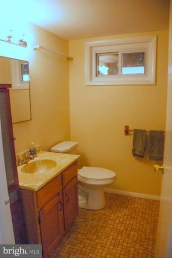 12607 Bluhill Road Silver Spring, MD 20906 - Photo 6 of 26 a bathroom with a sink and a toilet