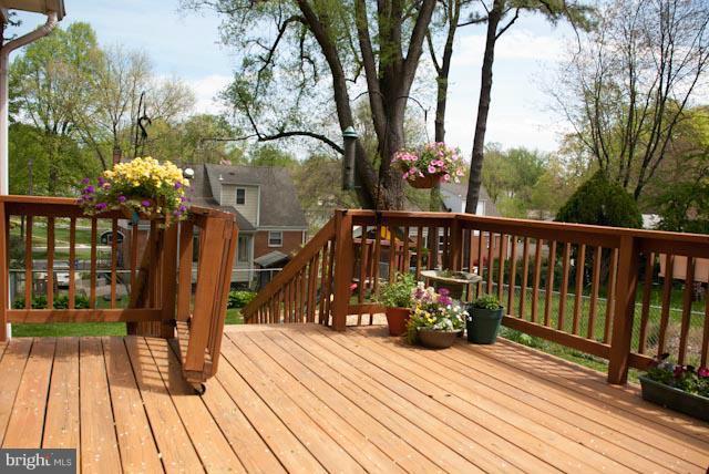 12607 Bluhill Road Silver Spring, MD 20906 - Photo 7 of 26 a view of balcony with wooden floor and fence