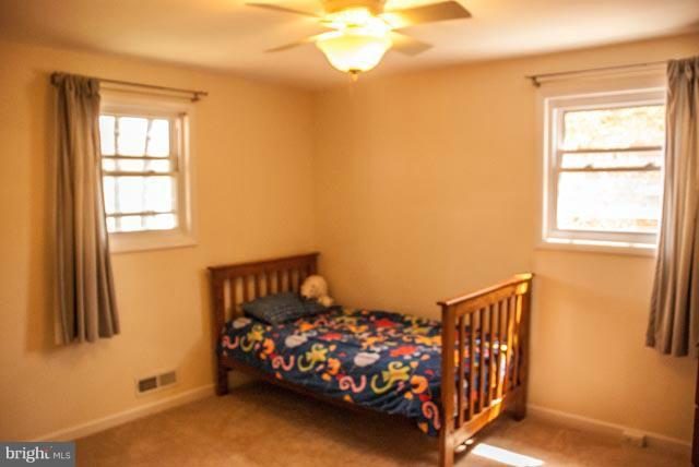 12607 Bluhill Road Silver Spring, MD 20906 - Photo 8 of 26 a bedroom with a bed and window