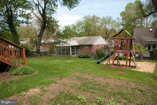 12607 Bluhill Road Silver Spring, MD 20906 - Photo 9 of 26 a view of a house with backyard and a tree