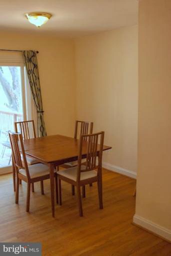 12607 Bluhill Road Silver Spring, MD 20906 - Photo 10 of 26 a view of a dining room with furniture and wooden floor