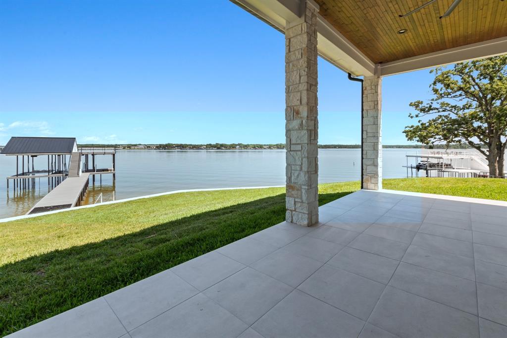 4054 Smothers Road Caney City, TX 75148 - Photo 10 of 40 Tiled covered patio conveniently positioned off both the living area and primary suite