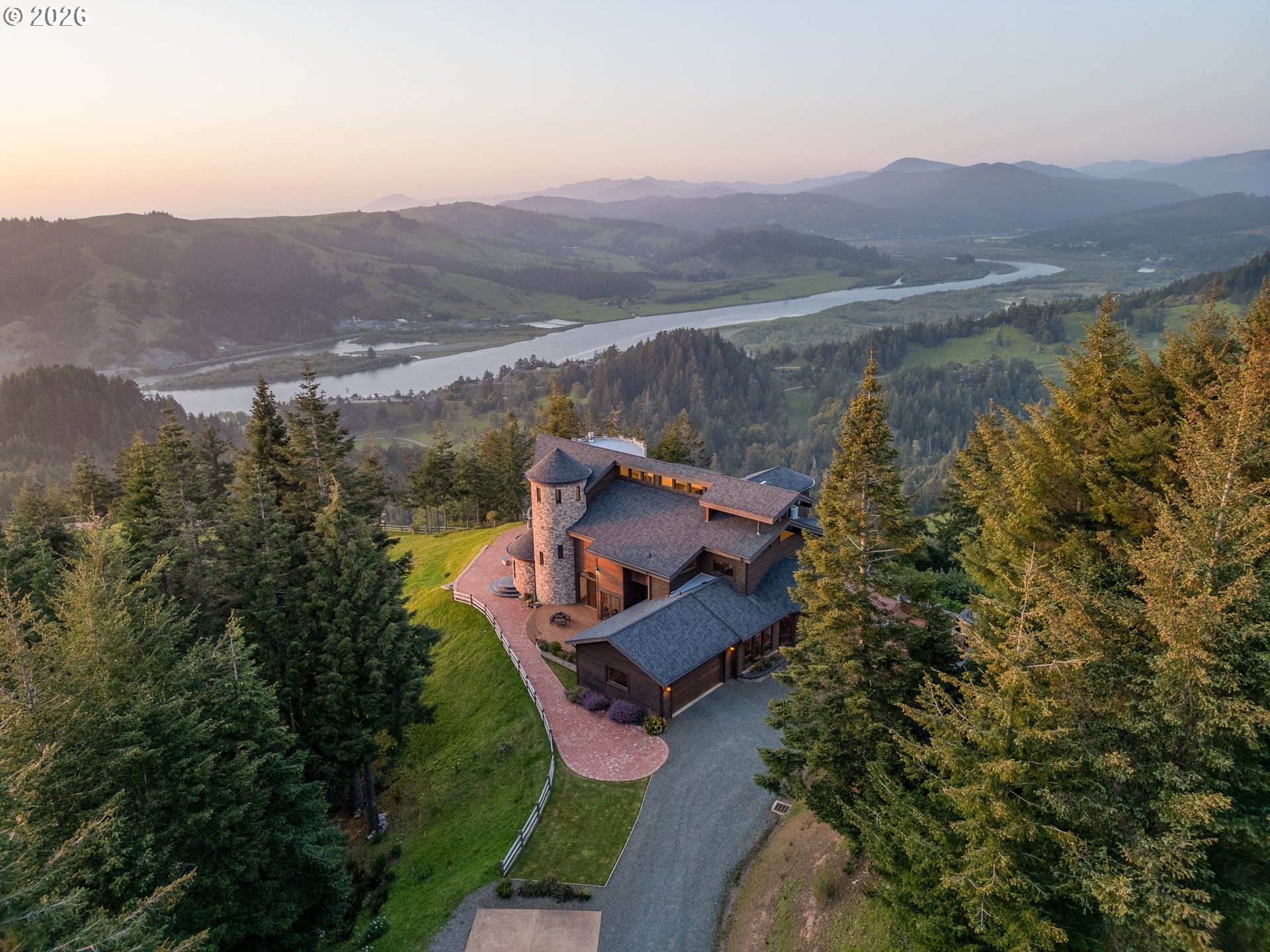 94880 Grizzly Mountain Road Gold Beach, OR 97444 - Photo 2 of 48 an aerial view of a house with mountain view