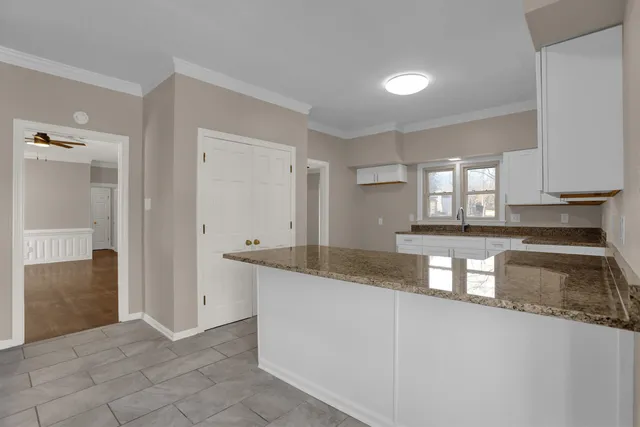 a kitchen with granite countertop a sink and a granite counter tops