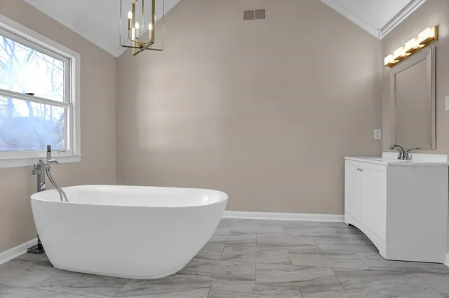 a white bath tub sitting in a bathroom
