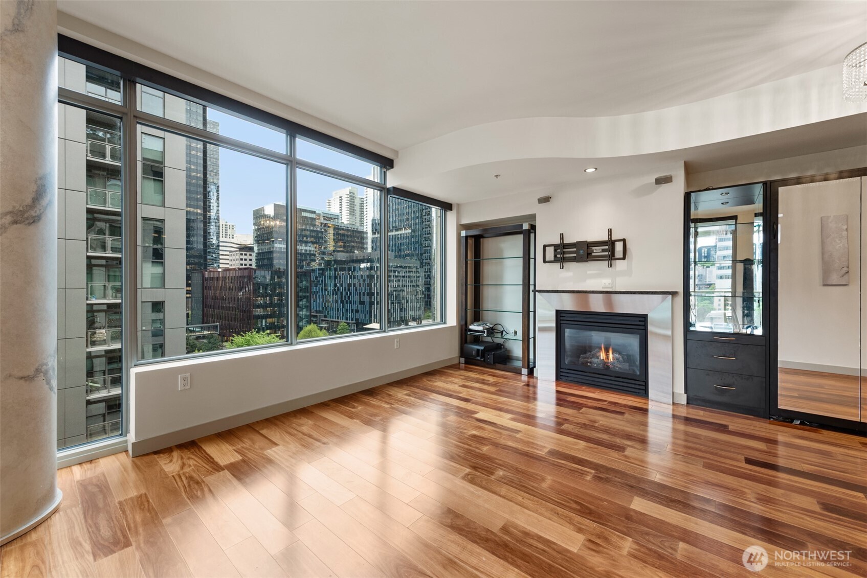 900 Lenora Street, Unit W801 Seattle, WA 98121 - Photo 1 of 36 a view of an empty room with a fireplace and a window