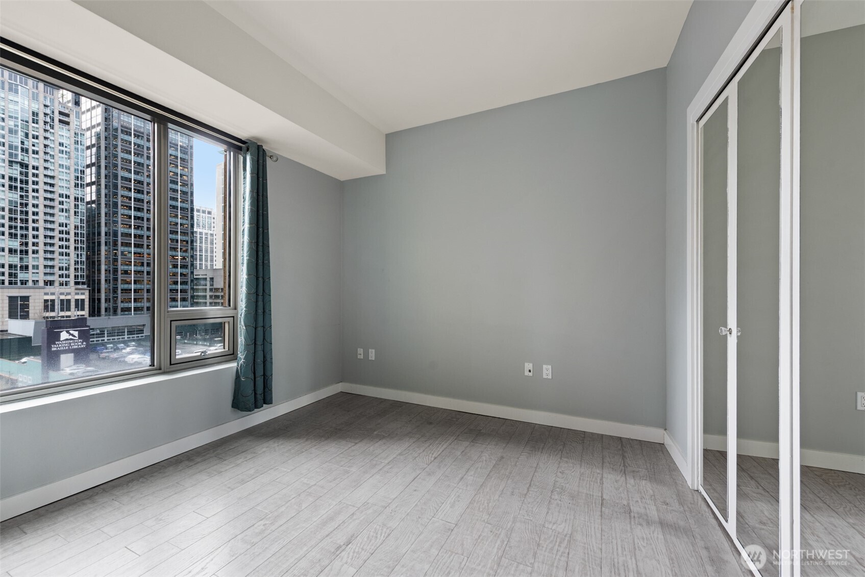 900 Lenora Street, Unit W801 Seattle, WA 98121 - Photo 13 of 36 a view of an empty room with a window