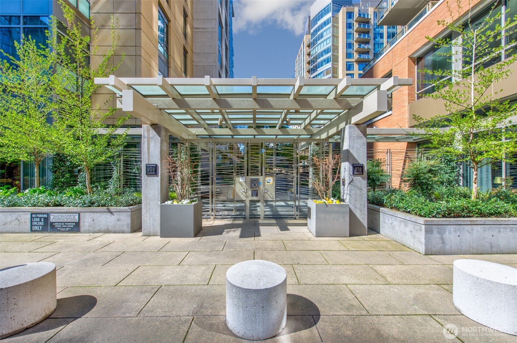900 Lenora Street, Unit W801 Seattle, WA 98121 - Photo 2 of 36 a view of a white building with swimming pool in front of it