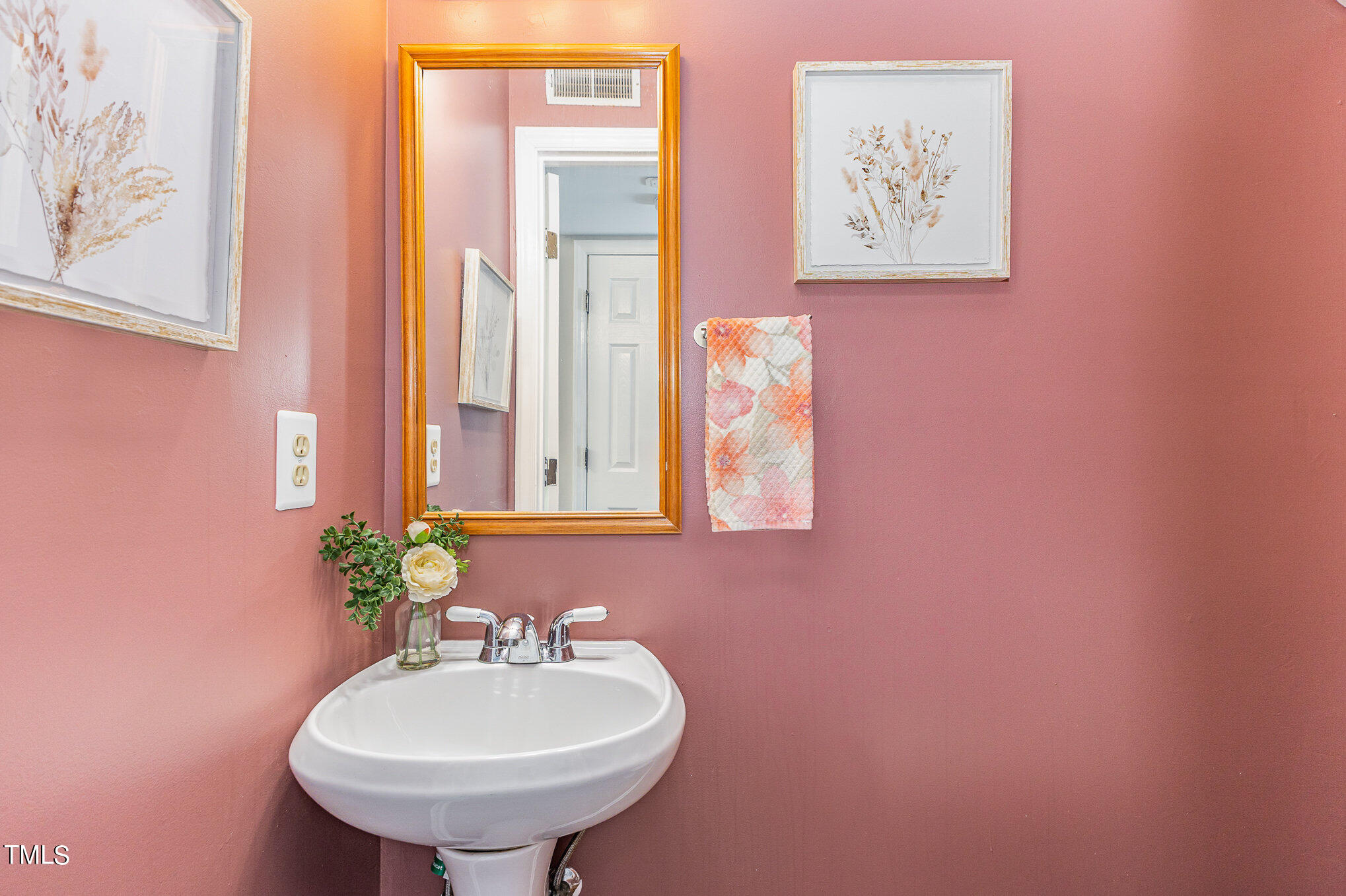 122 Rhum Place Garner, NC 27529 - Photo 11 of 19 a bathroom with a sink and a mirror