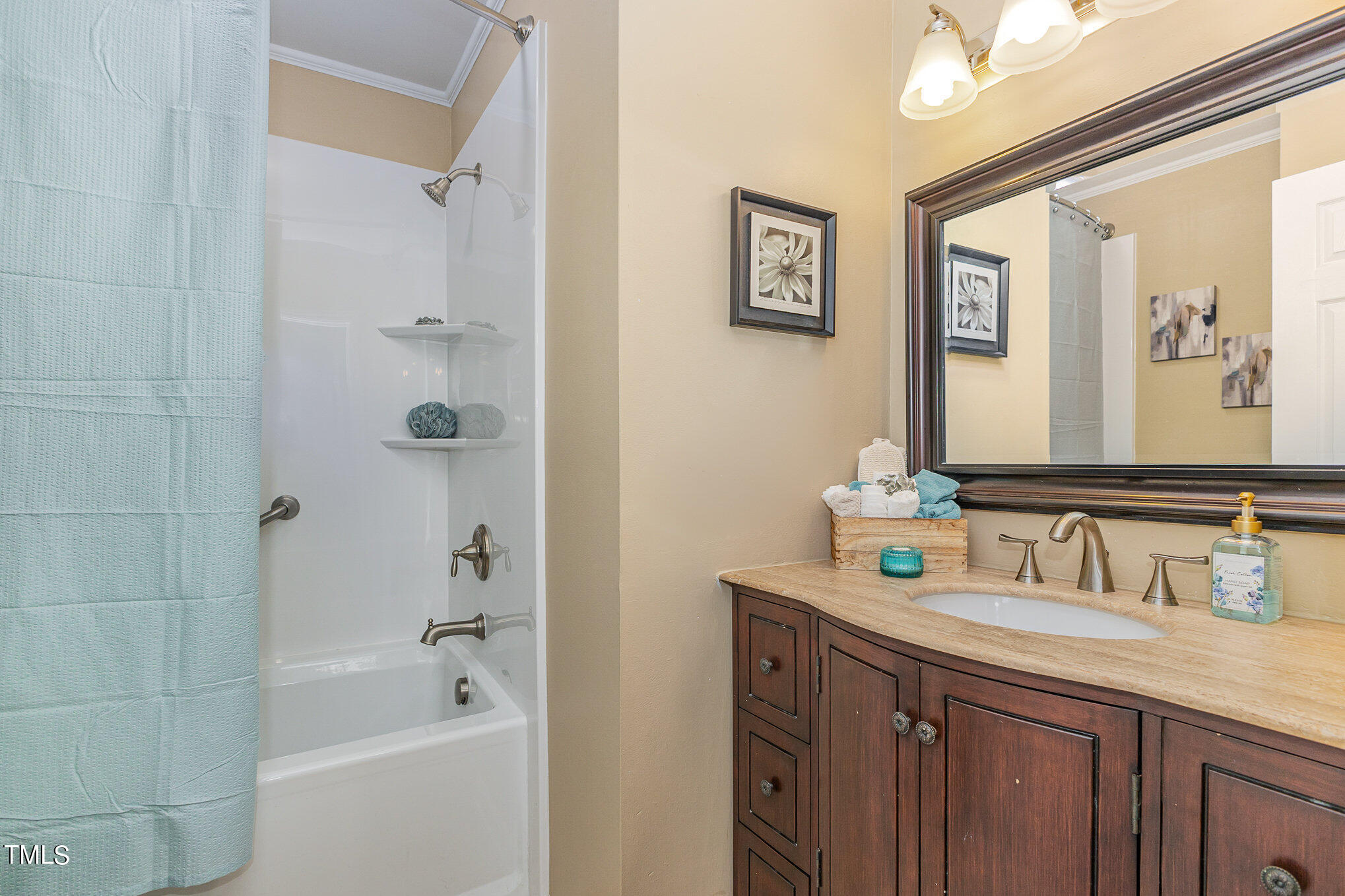 122 Rhum Place Garner, NC 27529 - Photo 15 of 19 a bathroom with a tub a sink and mirror