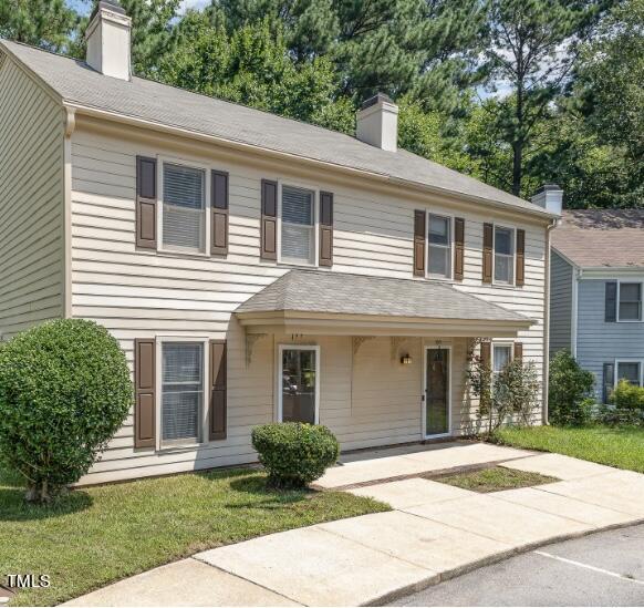 122 Rhum Place Garner, NC 27529 - Photo 2 of 19 a front view of a house with a garden