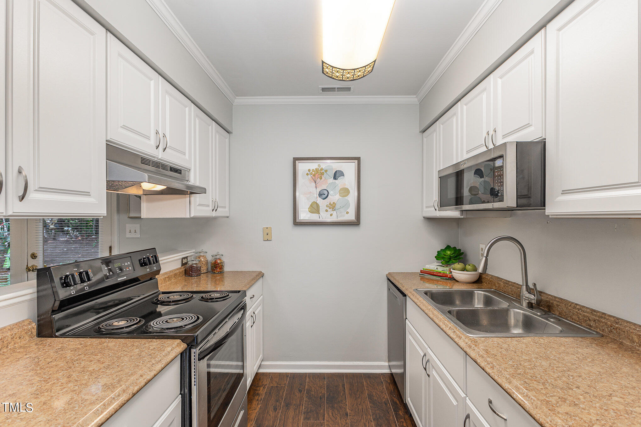 122 Rhum Place Garner, NC 27529 - Photo 6 of 19 a kitchen that has a sink and a stove