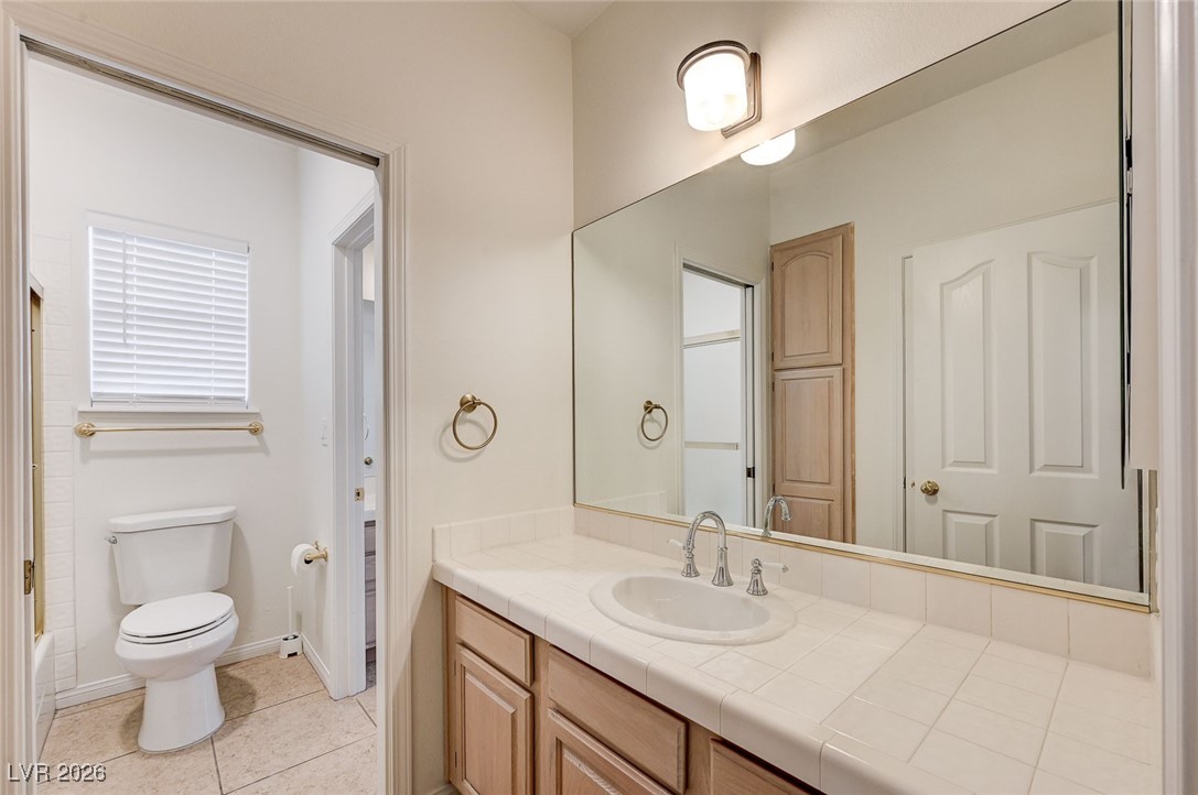 2955 El Camino Road Las Vegas, NV 89146 - Photo 50 of 99 Bathroom featuring vanity and light tile patterned floors