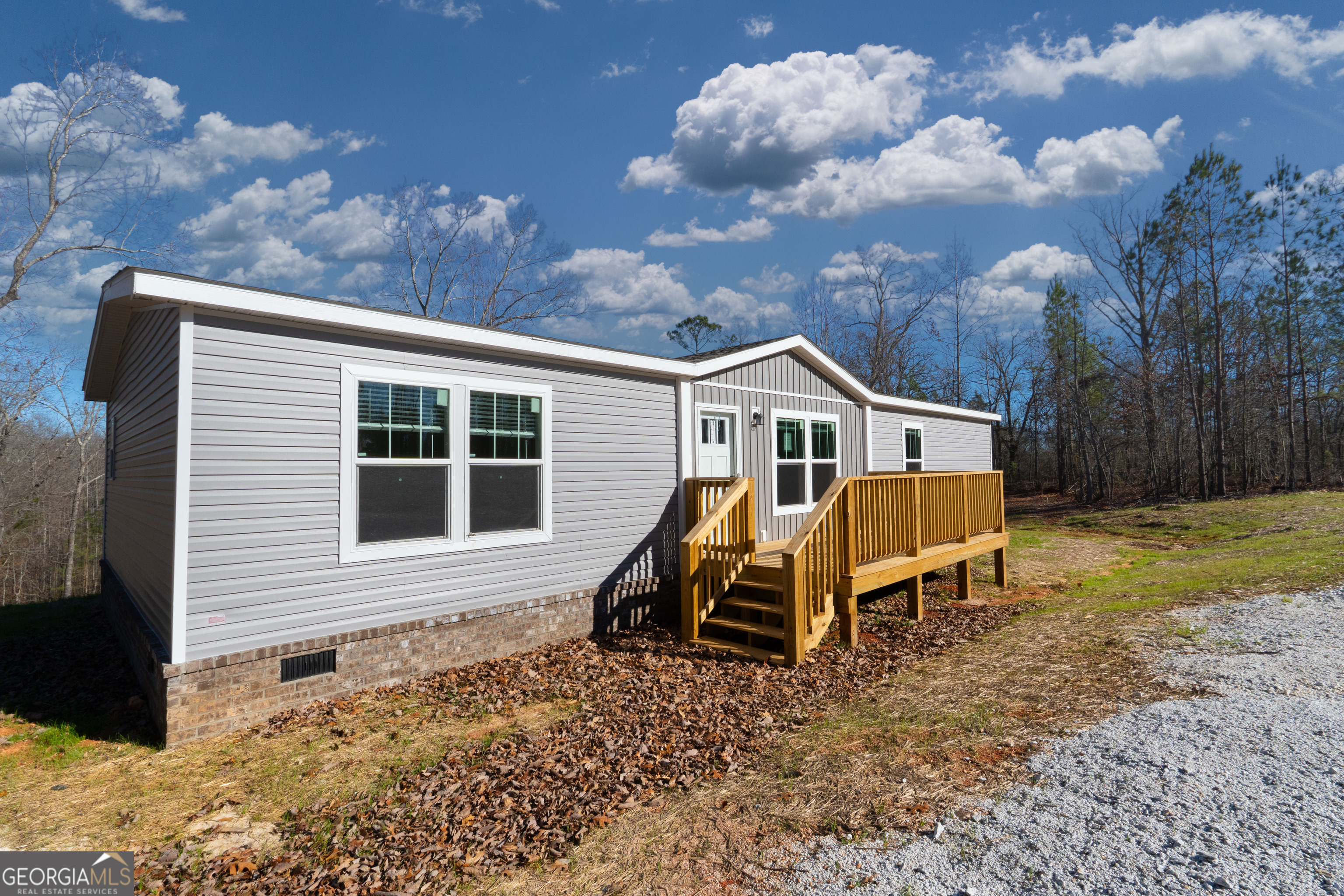 543 Hall Road Franklin, GA 30217 - Photo 11 of 50 a view of a house with backyard and sitting area