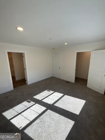 an empty room with wooden floor