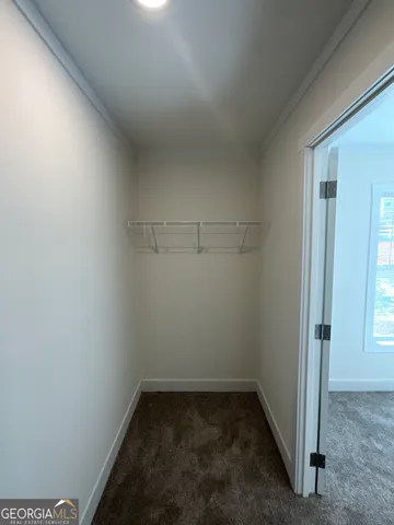 an empty room with a empty space and window