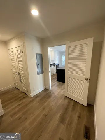 a room with a sink and cabinets