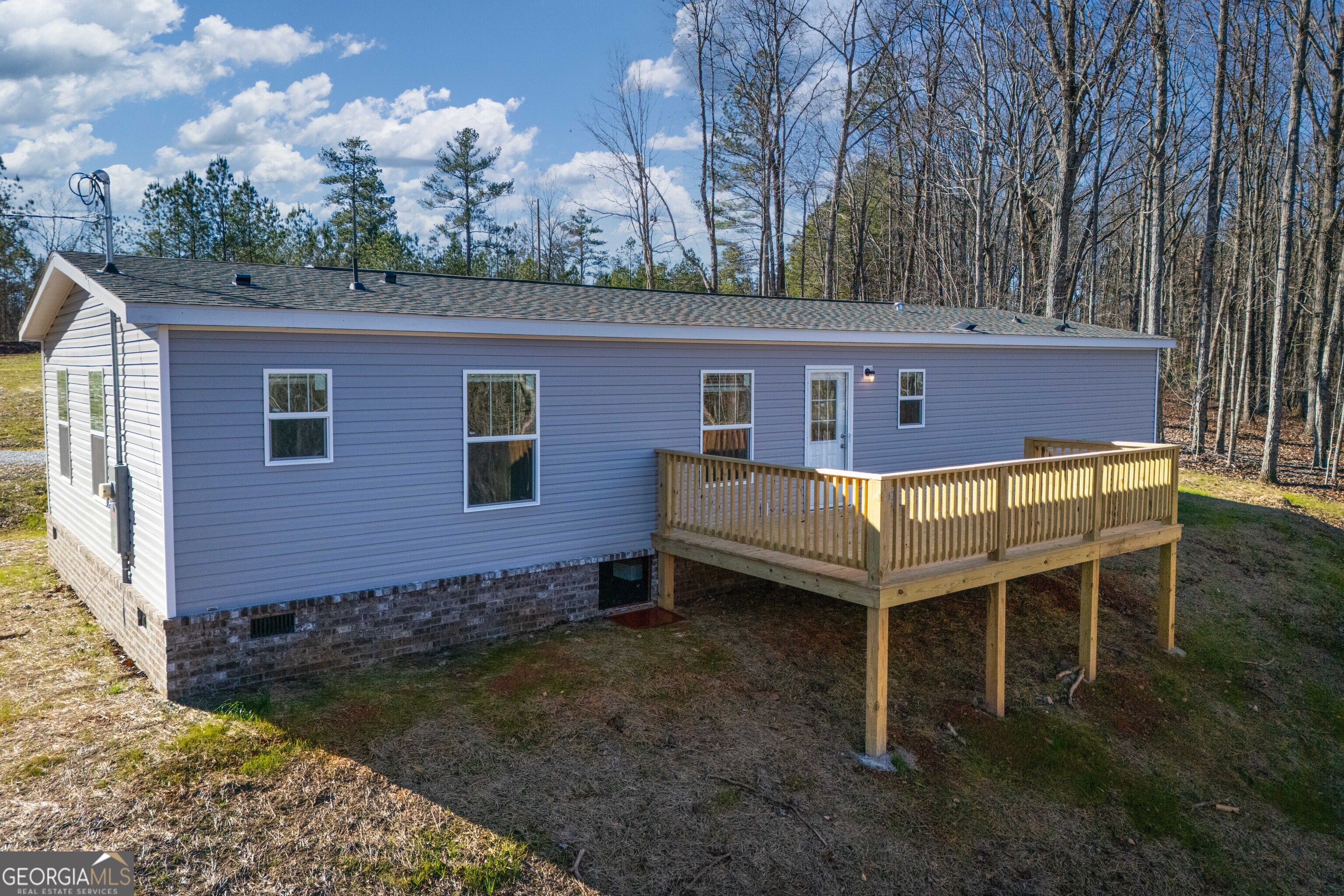 543 Hall Road Franklin, GA 30217 - Photo 3 of 50 a view of a chairs and table in the backyard