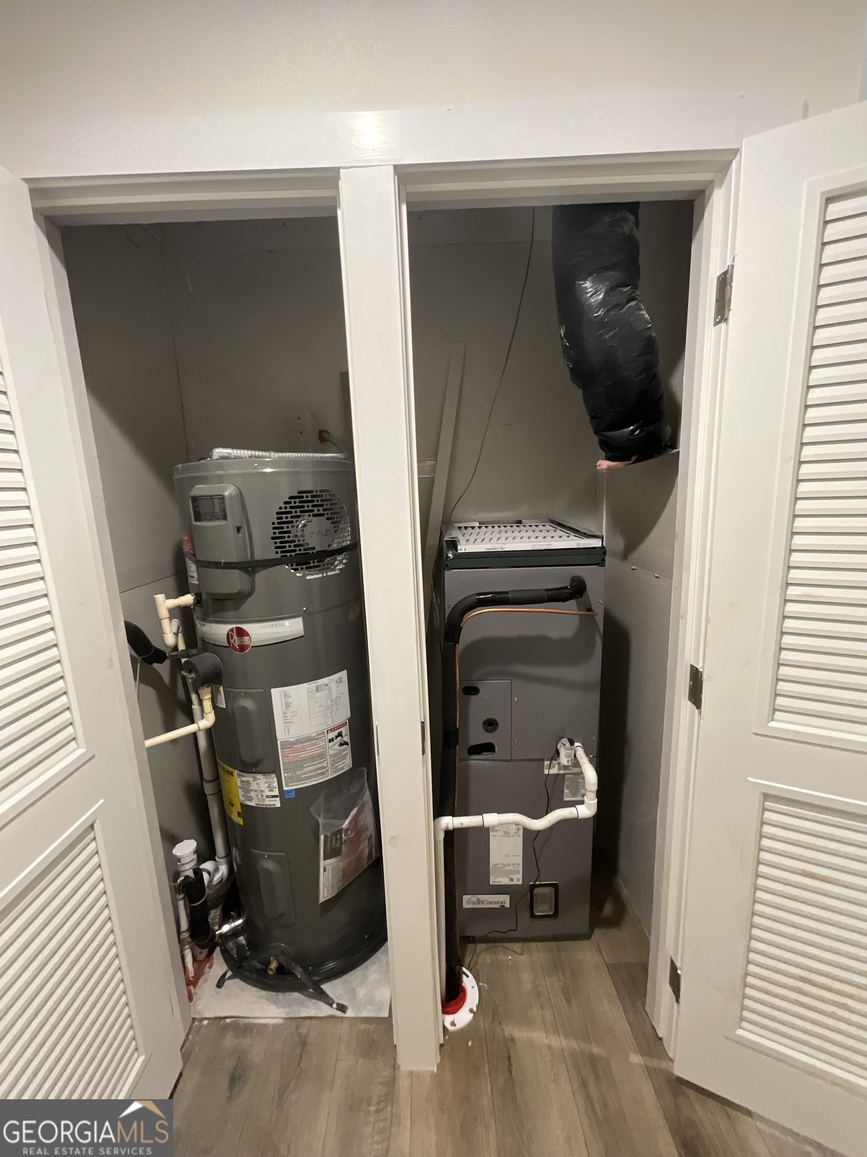 543 Hall Road Franklin, GA 30217 - Photo 35 of 50 a view of walk in closet with clothes and shoes