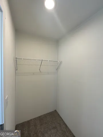 an empty room with a empty space and windows