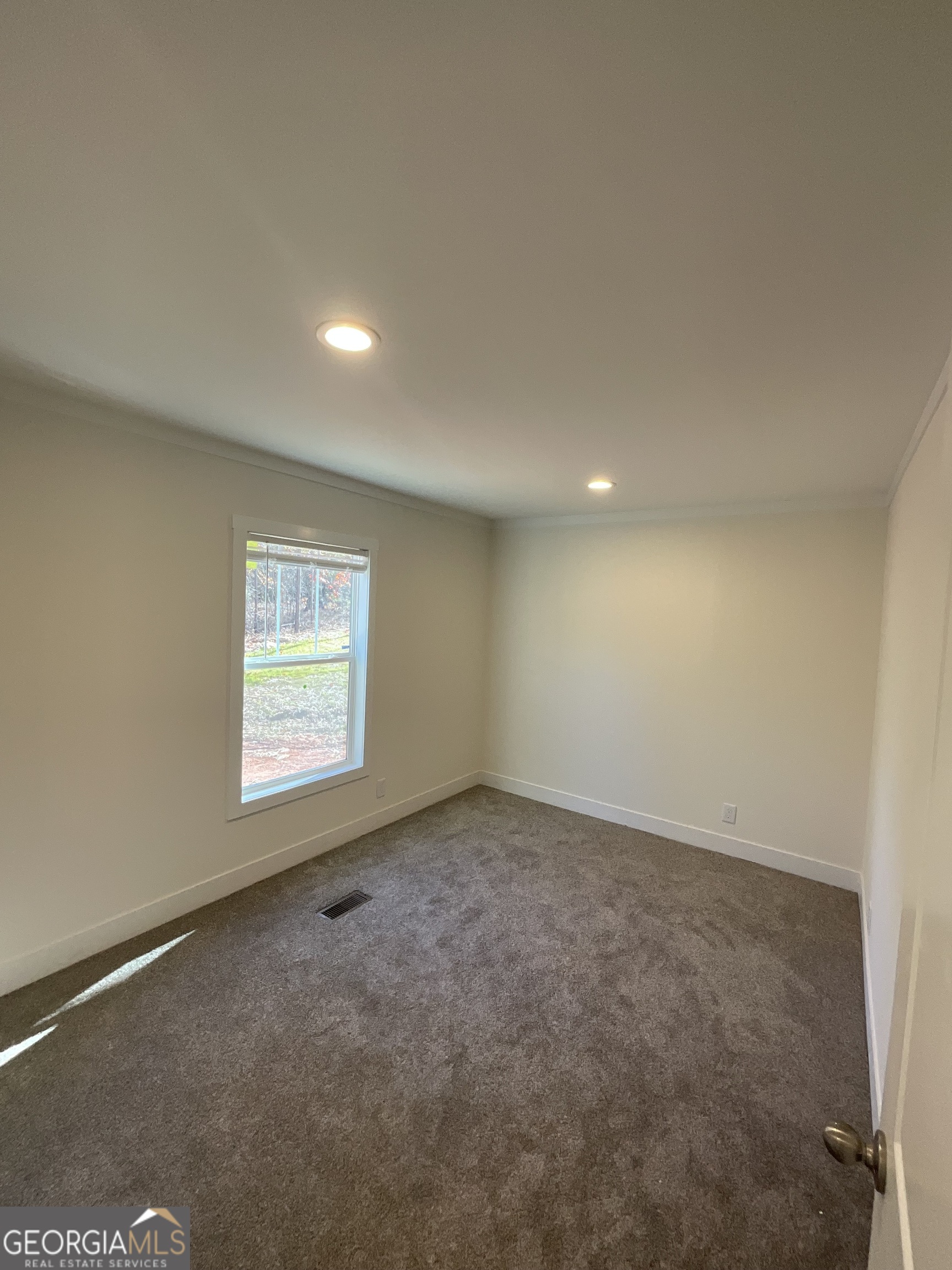 543 Hall Road Franklin, GA 30217 - Photo 42 of 50 an empty room with a empty space and windows