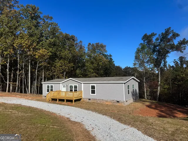 a house view with a backyard space
