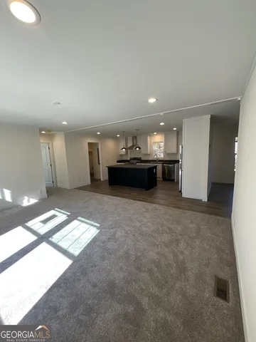 a view of a hall and kitchen