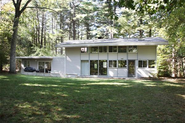 19 Demar Road Lexington, MA 02420 - Photo 1 of 1 a front view of a house with a garden