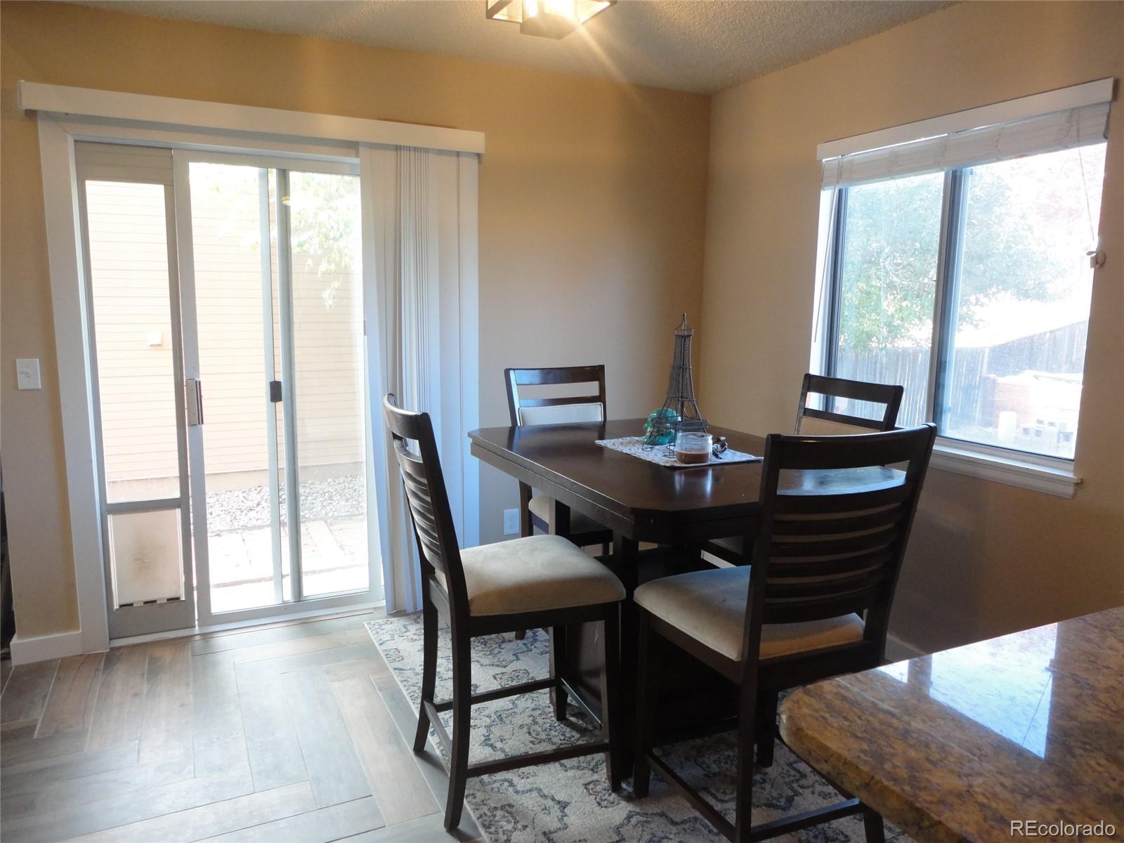537 James Street Highlands Ranch, CO 80126 - Photo 7 of 28 a view of a dining room with furniture and window