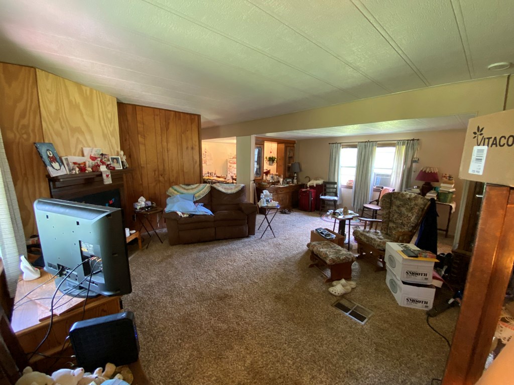 5197 Georgetown Road Franklin, PA 16323 - Photo 11 of 24 a living room with furniture window and a flat screen tv