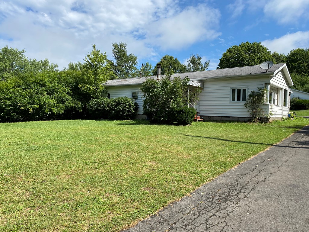 5197 Georgetown Road Franklin, PA 16323 - Photo 2 of 24 a view of a house with a yard and potted plants