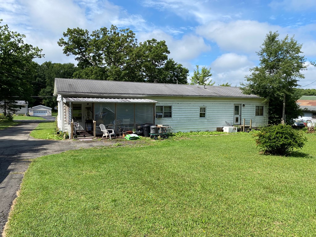 5197 Georgetown Road Franklin, PA 16323 - Photo 5 of 24 a view of a house with backyard sitting area and garden