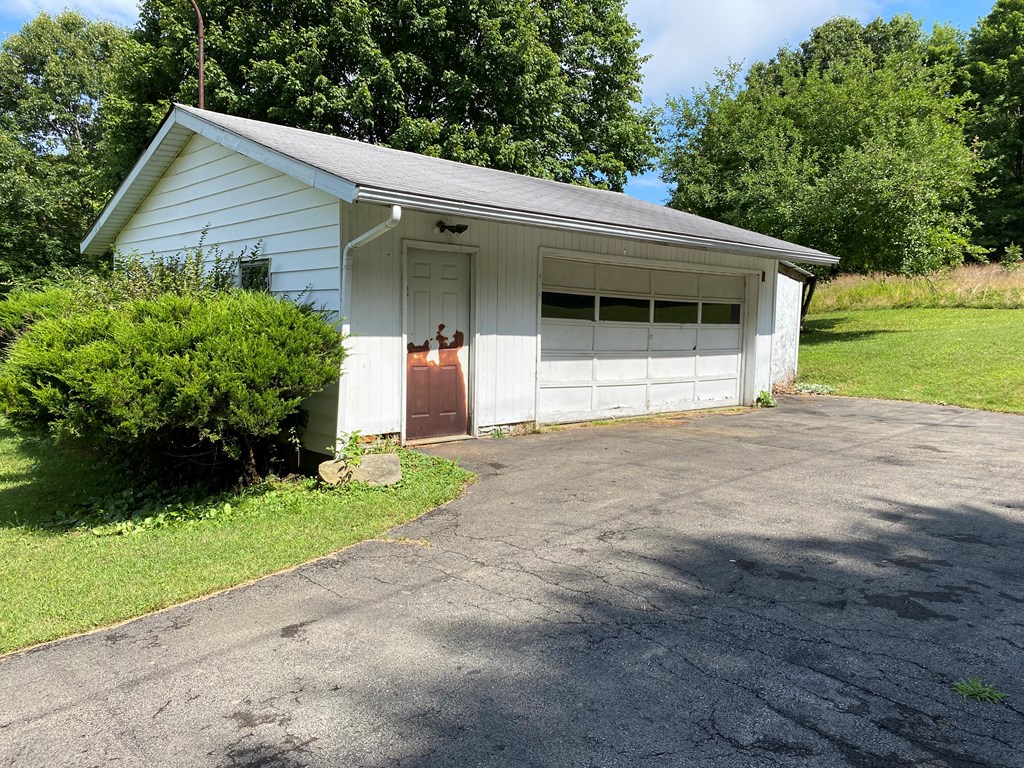5197 Georgetown Road Franklin, PA 16323 - Photo 6 of 24 a front view of a house with garden