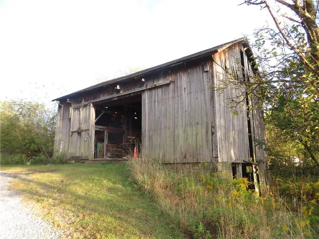 a house view with swimming pool in front of it