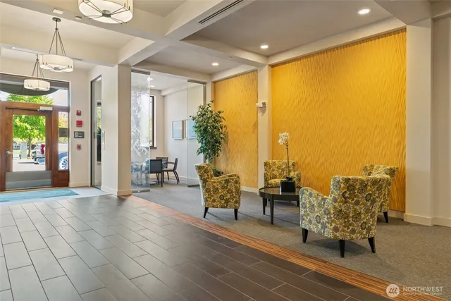 a room with furniture and gym equipment