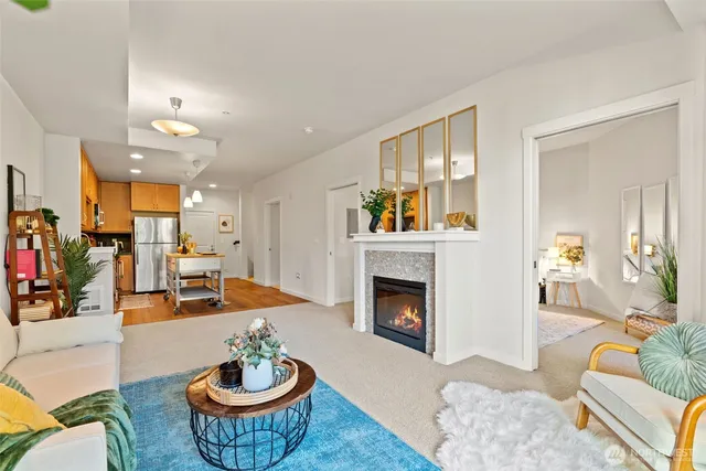 a living room with furniture and a fireplace