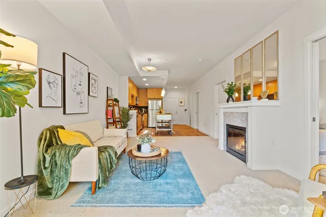 a living room with furniture and a fireplace
