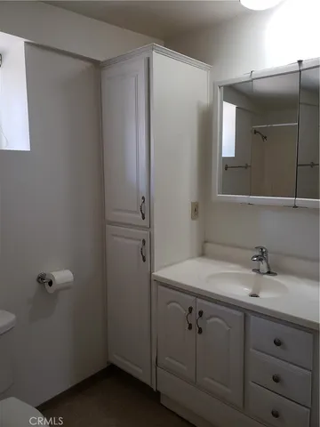 a bathroom with a sink and mirror
