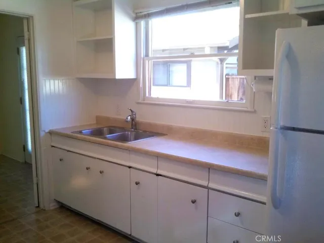 a kitchen with a sink and a window