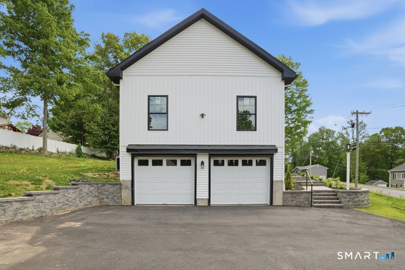 796 Maple Hill Road Naugatuck, CT 06770 - Photo 30 of 35 a view of a house with a yard and a large tree