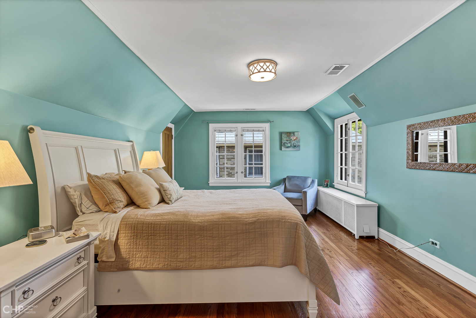 297 Scottswood Road Riverside, IL 60546 - Photo 18 of 29 a bedroom with a bed and wooden floor