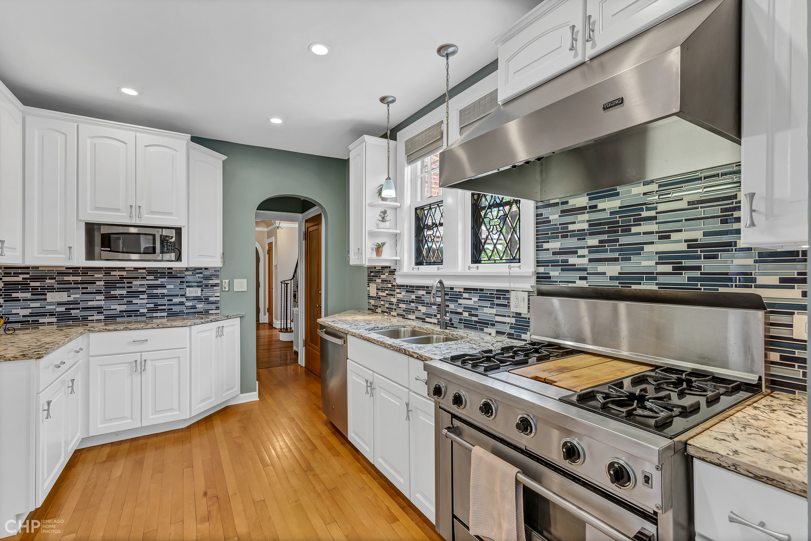 297 Scottswood Road Riverside, IL 60546 - Photo 9 of 29 a kitchen with stainless steel appliances granite countertop a stove and a sink