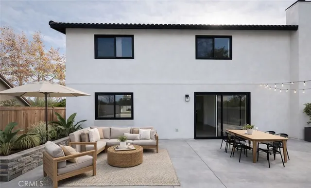 a outdoor space with patio furniture and potted plants