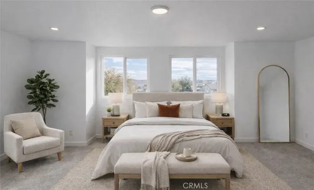 a bedroom with a bed and a couch