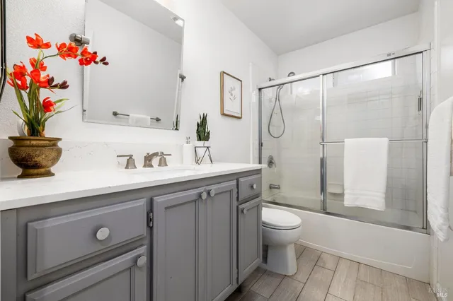 a bathroom with a sink a vanity and a mirror